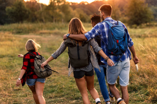 istock Group of four friends hiking through countryside. 1066539108