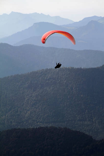istock Paragliding in front of alpine panorama 1066546632