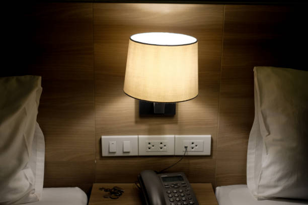 istock Bed lamp in bedroom in luxury hotel 1066547458