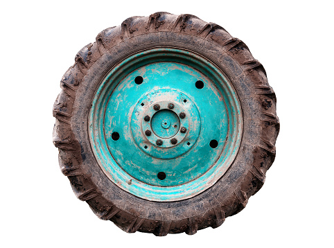 dirty used tractor wheel isilated on white