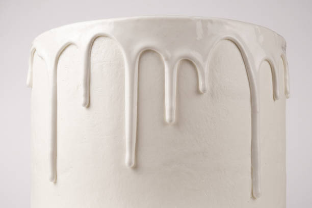istock Simple white cake with glaze on a white background. 1066555526