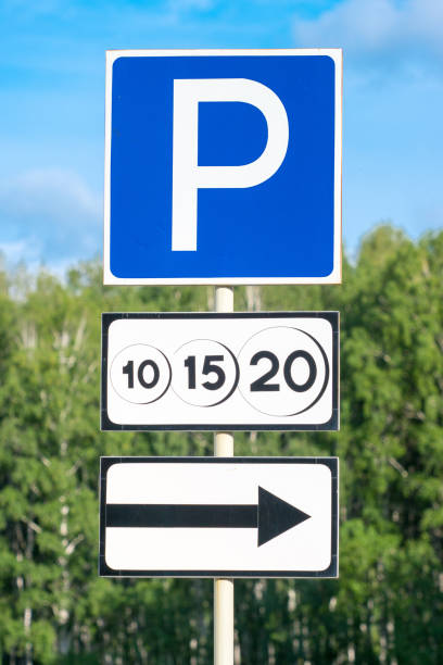 istock paid parking road sign with movement direction arrow 1066557904