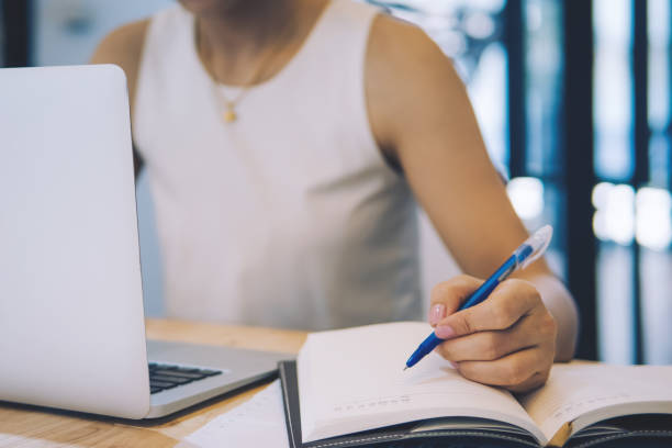 istock Young business women working for new projects and taking notes in notebook at office.Teamwork successful Meeting Workplace strategy Concept. 1066560428