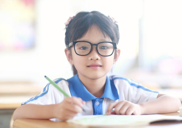 istock Schoolgirl doing homwork 1066562768