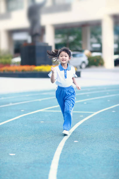 istock Girl standing on school playground 1066566092