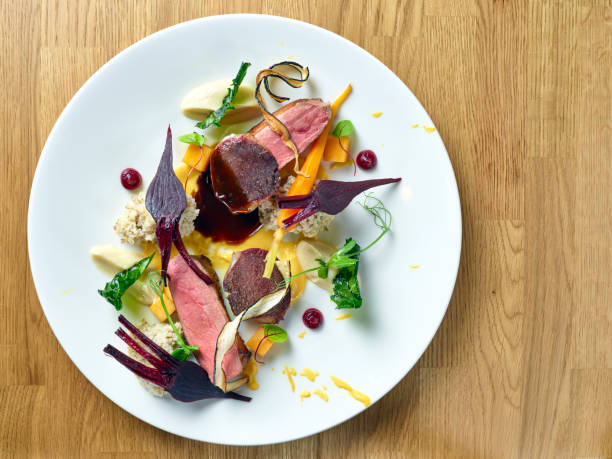 istock Duck breast with baby beetroots and dumplings closeup 1066570342