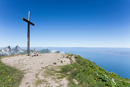 Cross on le Grammont mountain and lake Geneva on the background (Switzerland)