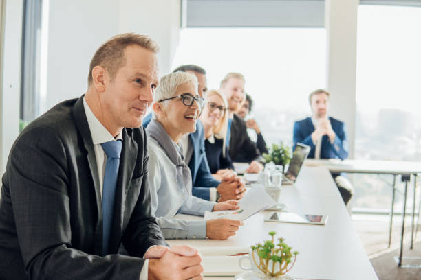 istock Coworkers sitting at conference table 1066582424