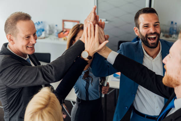 istock Happy business people giving each other high five 1066582434