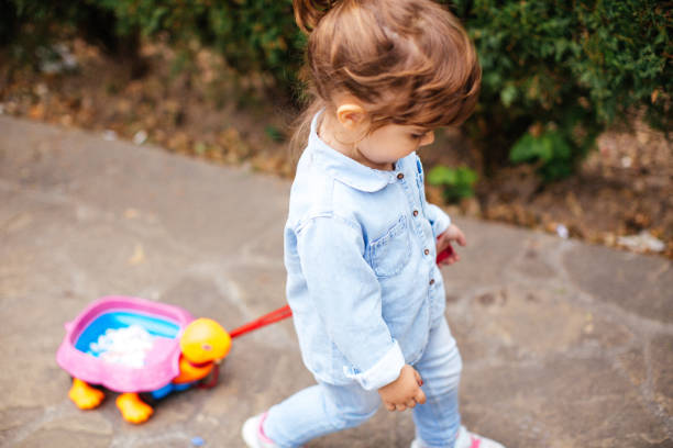 istock Little girl pulling her turtle toy 1066584812