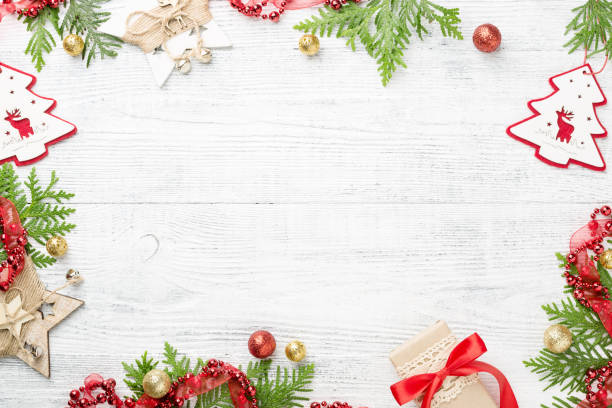 istock Festive frame of rustic Christmas decorations on light copy space. 1066589074