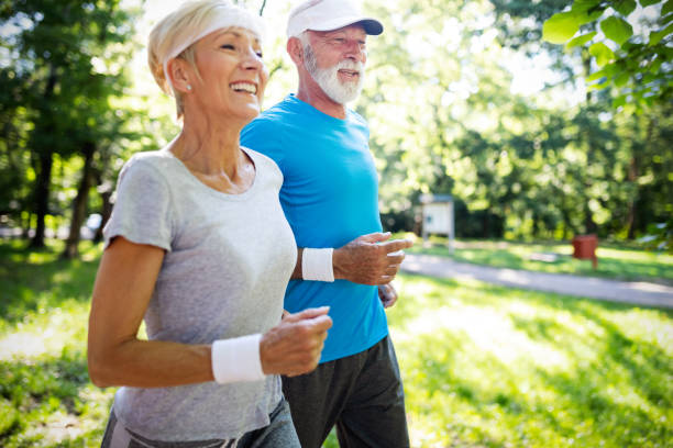 istock Mature couple jogging and running outdoors in nature 1066593606