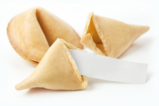 Chinese Fortune Cookie open with blank paper, on white background