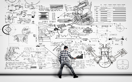 Solving A Mathematical Problem Scene Young Man Solving Math Problema Drawn On A White Wall Stock Photo ...