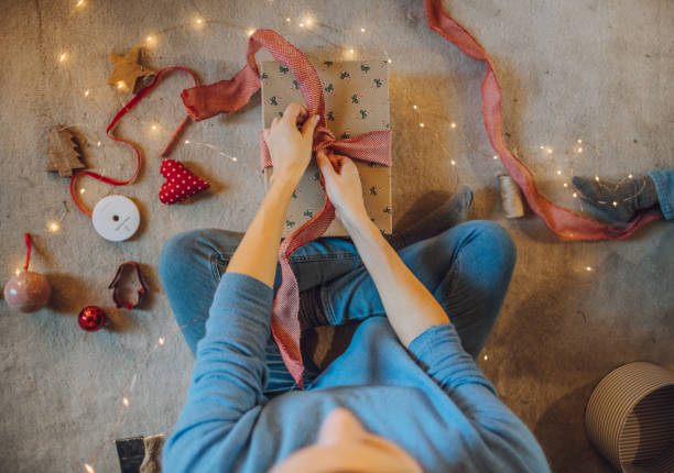 istock Woman wrapping gifts 1066606460