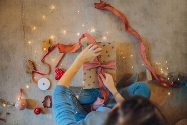 istock Woman wrapping gifts 1066606616