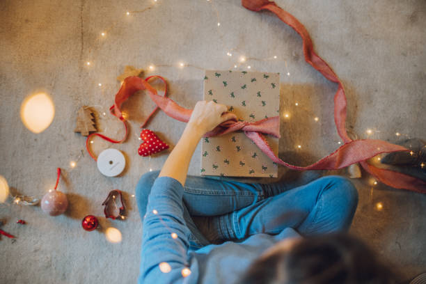 istock Woman wrapping gifts 1066606678