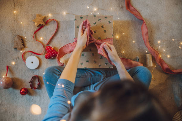 istock Woman wrapping gifts 1066606714