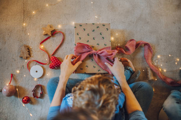 istock Woman wrapping gifts 1066606852