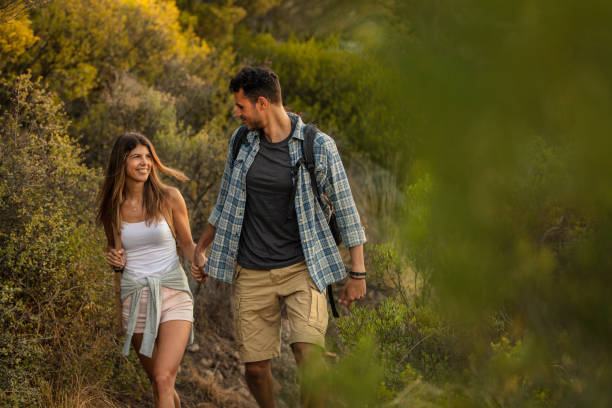 istock Couple in love on a mountain hike 1066613306