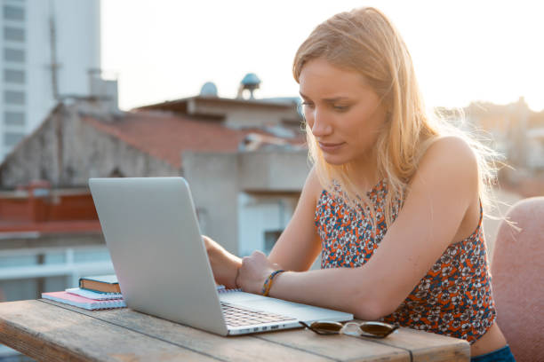 istock Portrait of a young woman using laptop 1066617864