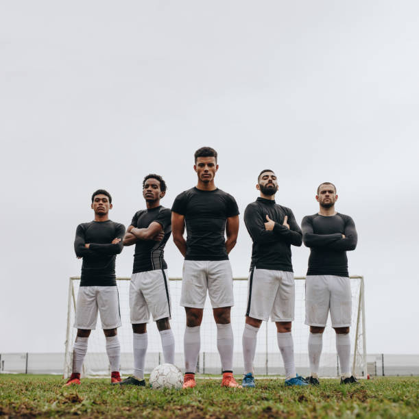istock Soccer players standing on the field during practice 1066619720