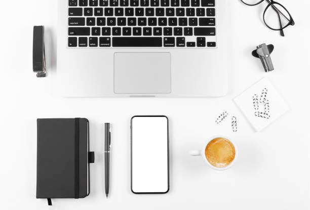 istock White office desk table with a lot of things on it. Top view with copy space. 1066620234