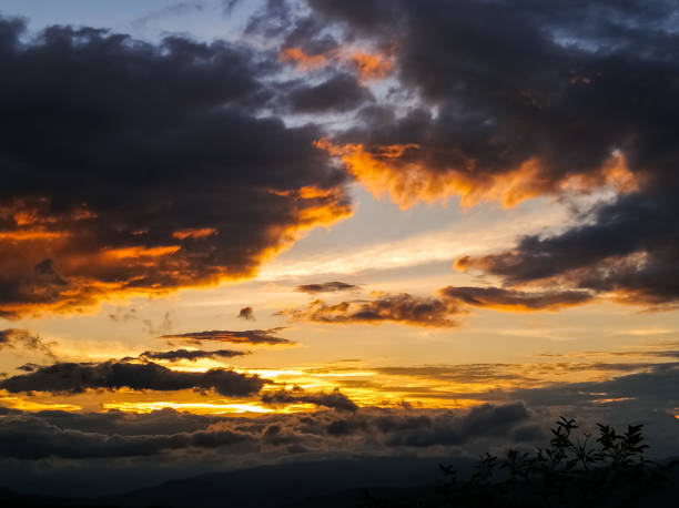 istock Orange fire sunset over mountain horizon 1066621698