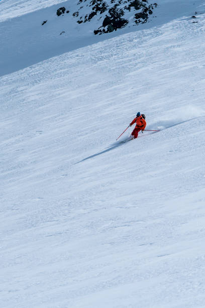 istock Backcountry skier flies down slope 1066621888