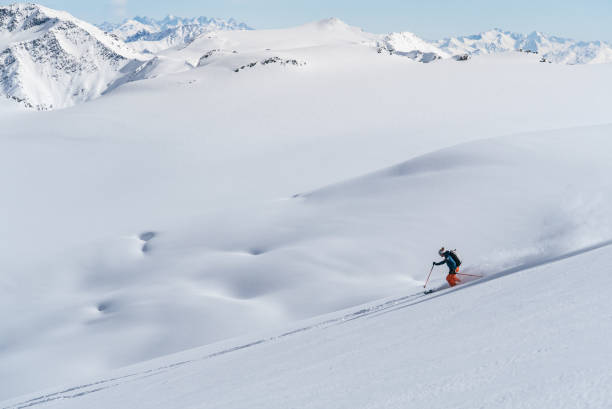 istock Backcountry skier flies down slope 1066621908