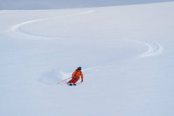 istock Backcountry skier flies down slope 1066621924
