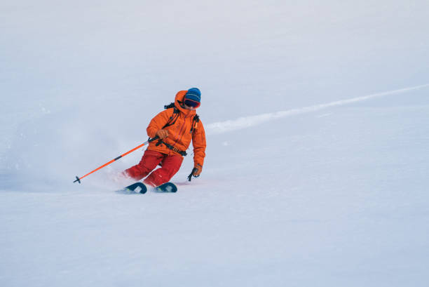 istock Backcountry skier flies down slope 1066621944