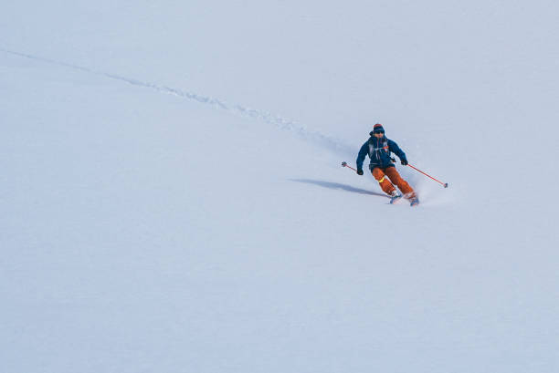 istock Backcountry skier flies down slope 1066621958