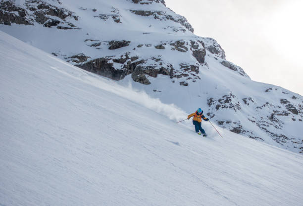istock Backcountry skier flies down slope 1066621970