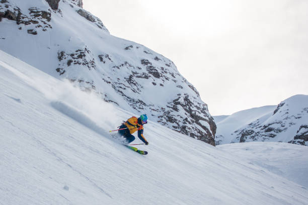 istock Backcountry skier flies down slope 1066621972