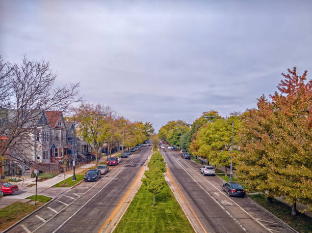 Northward perspective of North Kedzie Boulevard, a tree lined neighborhood street. Chicago, Illinois. Urban landscape. stock photo
