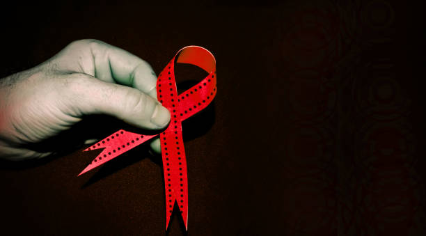 istock Man holding a blue ribbon, blue november concept 1066625770