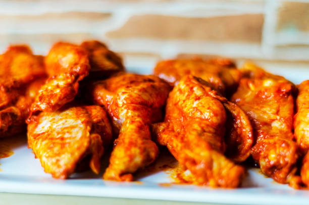 istock chicken wings marinated in a barbecue sauce, a typical American snack, 1066628948