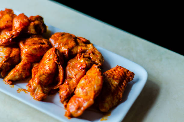 istock chicken wings marinated in a barbecue sauce, a typical American snack, 1066629996