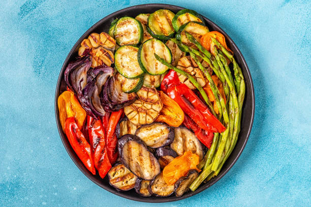 istock Grilled vegetables on a plate with sauce 1066630084