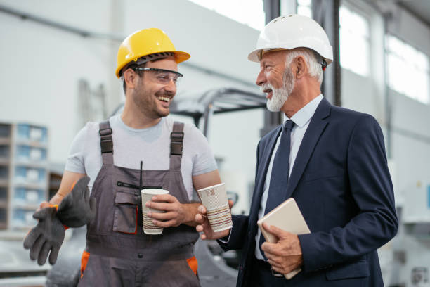 istock Engineer with inspector on coffee break in factory 1066630386