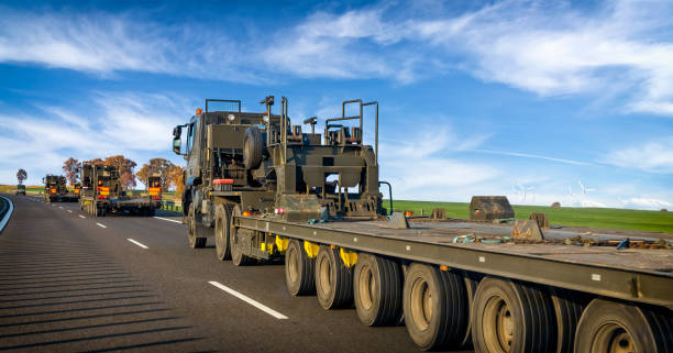 istock Military truck trailers on the highway 1066633110
