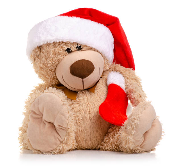 istock Christmas toy bear with santa hat 1066648218