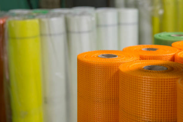 Rolls of colored fiberglass mesh, building materials for wall insulation, close-up