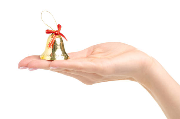 istock Christmas toys bells in hand 1066648590