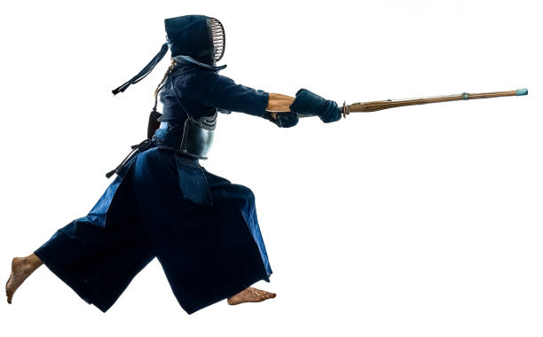 istock Kendo martial arts fighters silhouette isolated white bacground 1066652980