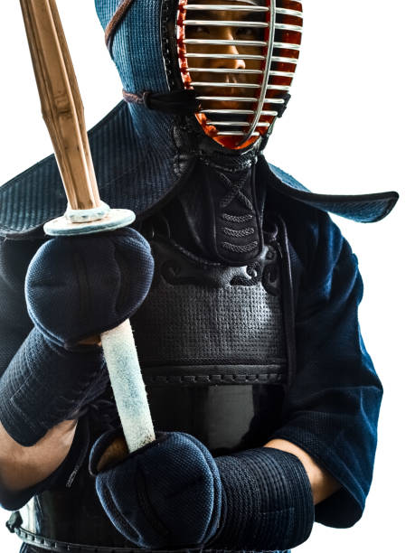 istock Kendo martial arts fighters man silhouette isolated white bacgro 1066653284
