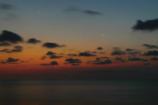 istock Beautiful sunset in Bali island with visible smiling moon and north star 1066654736