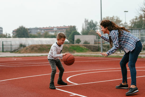 istock Happy family playing basketball 1066655476