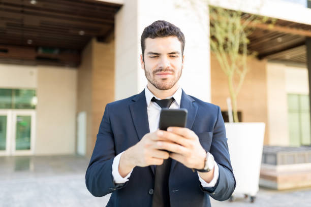 istock Handsome Businessman Reading Information From Website 1066660330